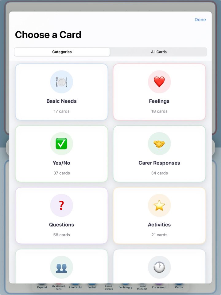 Choosing a communication card in Kammunicate, with categories like Basic Needs, Feelings, Yes/No and Carer Responses